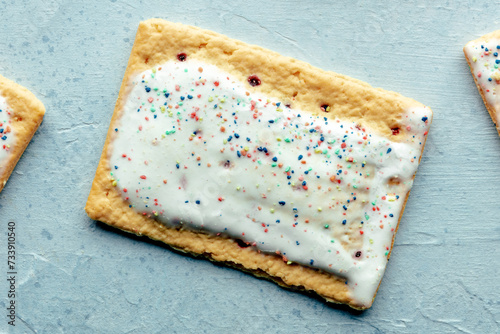 Pop tart close-up. Poptart toaster pastry with icing on a blue slate background