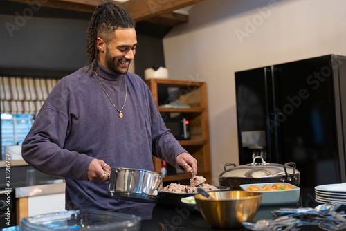 Man preparing meal in kitchen 