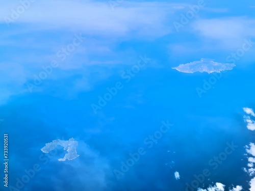 evocative image of the Isola del Giglio in front of Grosseto (Tuscany) 
in Italy seen from an airliner