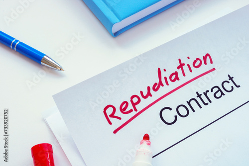 Contract with handwritten inscription repudiation on the table.