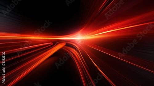 Bright light streaks in motion against a dark background photo
