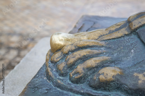 Bishop Grgur statue, belief connected with the bronze statue which says that touching the big toe will fulfill one's wishes, city of Nin, Zadar county, Croatia, 16:12.2023 photo