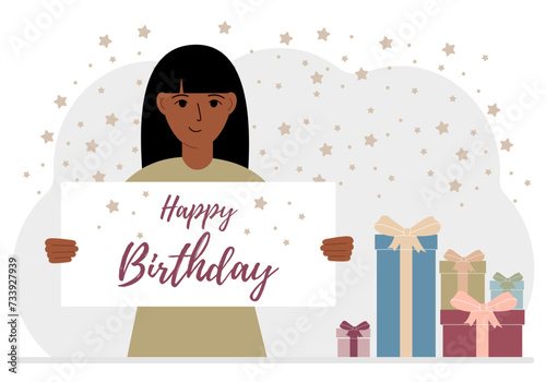 A woman holds a card with a happy birthday in his hands.