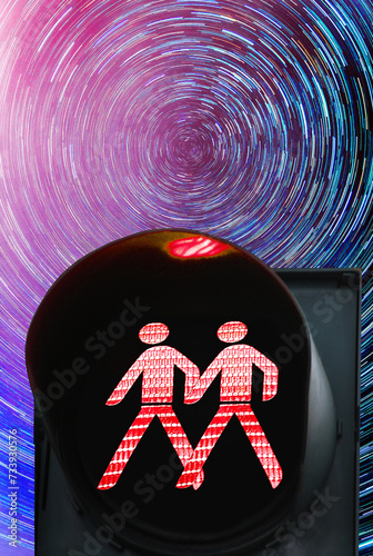 Same sex pedestrian red traffic light on the background of star tracks at night time