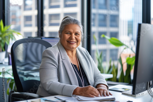 senior indigenous business woman portrait in modern office, diversity  photo