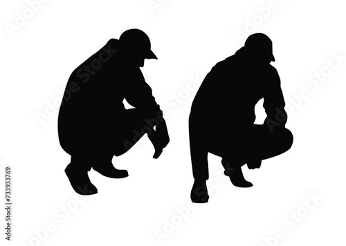 Fototapeta Naklejka Na Ścianę i Meble -  Man Squatting Silhouette. A young male in cap sitting pose
