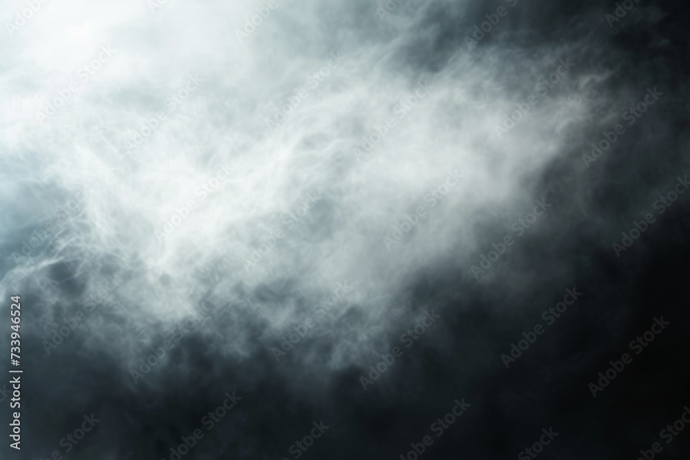 Fototapeta premium Wispy white and gray smoke swirls against a black background