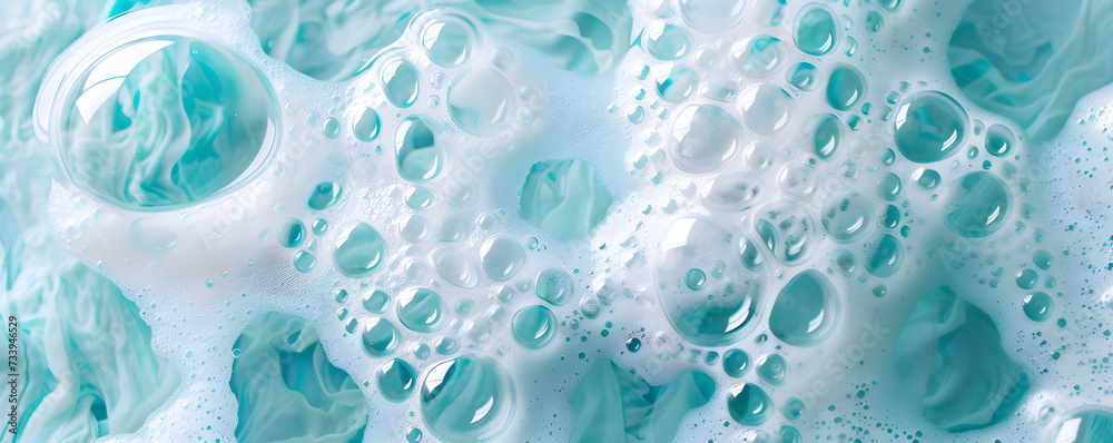 Macro photo of bubbles in water. Background with foam made of soap, shampoo, lotion, detergent in blue colour. Banner with copy space for laundry and cleaning services, spa, beauty, skin care concept.