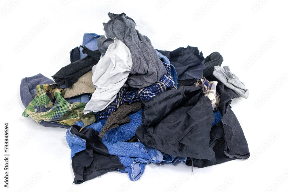 A pile of textile scraps on white background. Lots of textile fabric scraps. Textile waste. Eco-conscious brands, recycling campaigns, creative designs, sustainability projects.
