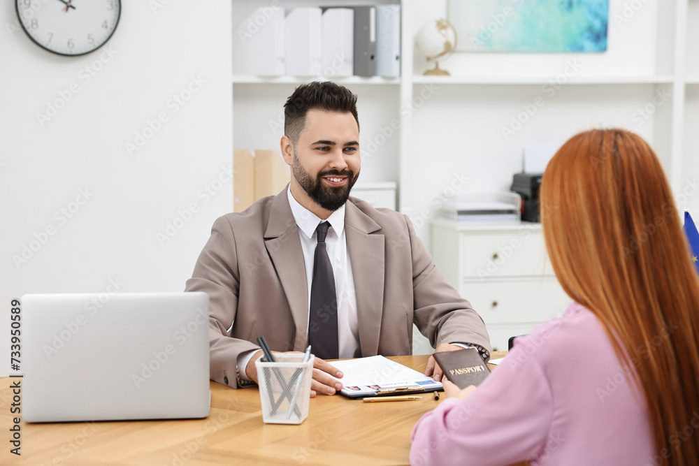 Immigration. Woman having interview with embassy worker in office Immigration. Woman having interview with embassy worker in office