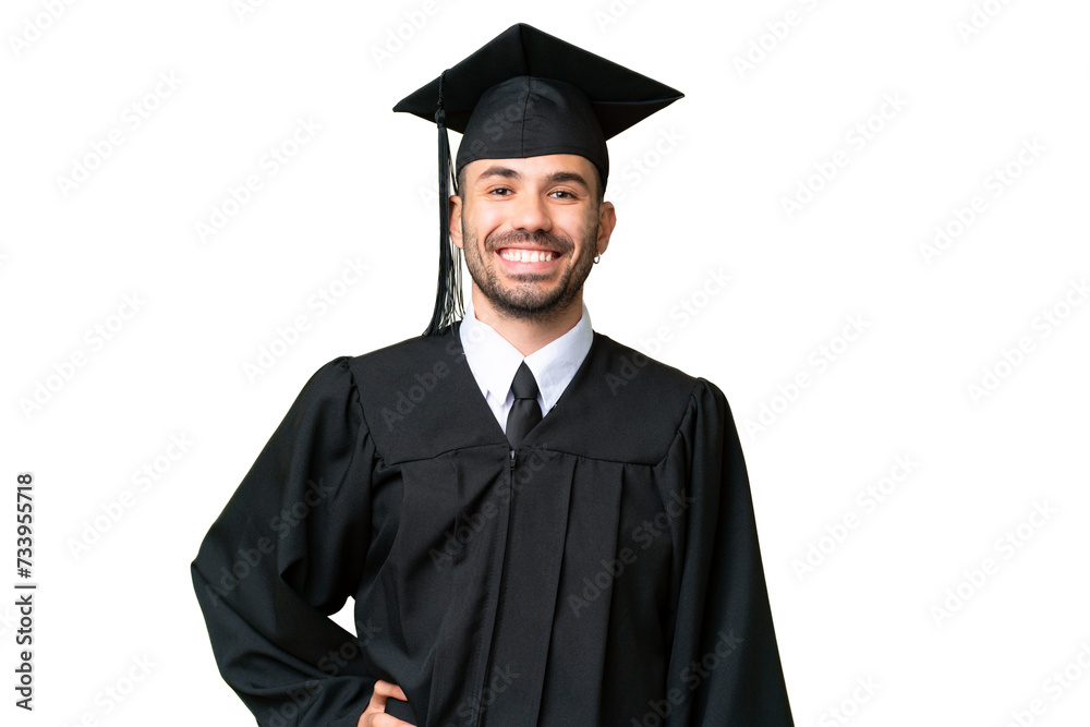 Young university graduate man over isolated chroma key background posing with arms at hip and smiling Young university graduate man over isolated chroma key background posing with arms at hip and smiling