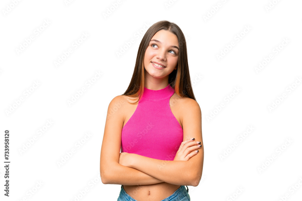 Teenager caucasian girl over isolated background looking up while smiling Teenager caucasian girl over isolated background looking up while smiling
