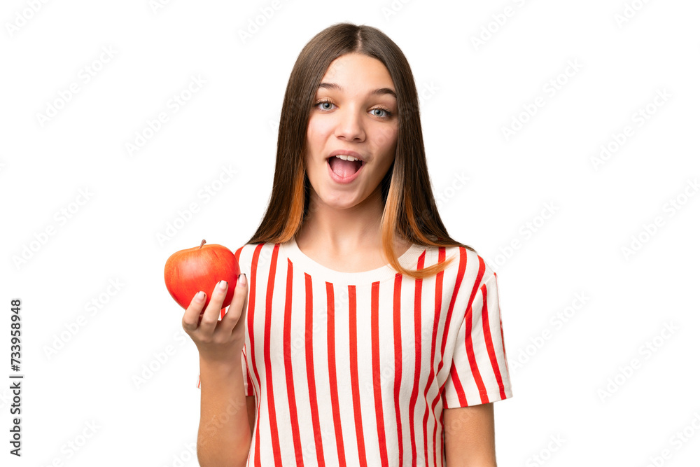 Teenager girl with an apple over isolated chroma key background with surprise and shocked facial expression Teenager girl with an apple over isolated chroma key background with surprise and shocked facial expression