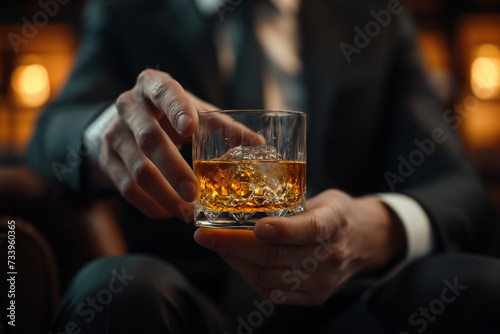 Man in Suit Enjoying Whiskey by Fireplace