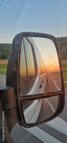 on the road looking on the sunset in reear mirror © Michaela Holubová