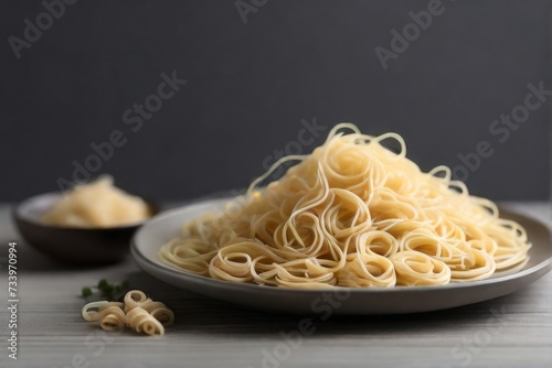 Minimalist composition featuring pasta neatly arranged on a grey wooden tabletop