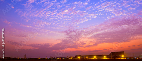 Photography Silhouette row of factory buildings in industrial settlement zone against dramat