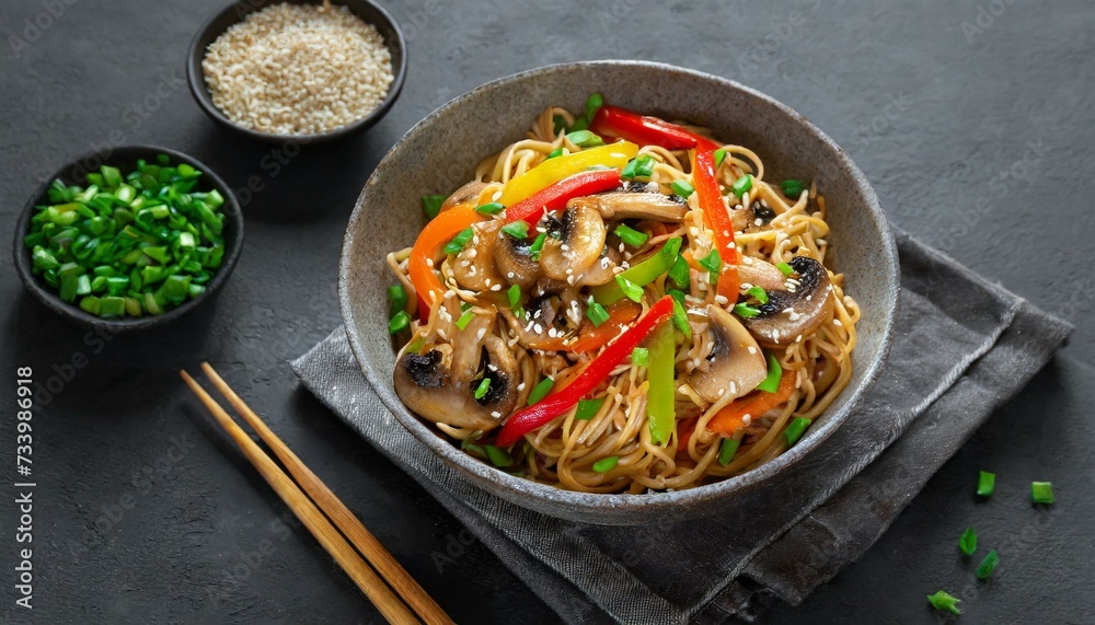 Fried noodles with vegetables, peppers, mushrooms, chives and sesame Asian cuisine Fried noodles with vegetables, peppers, mushrooms, chives and sesame Asian cuisine
