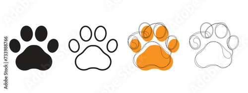 Hand-drawn vector images of dog paws and simple black paw icons. Set of paw icons.