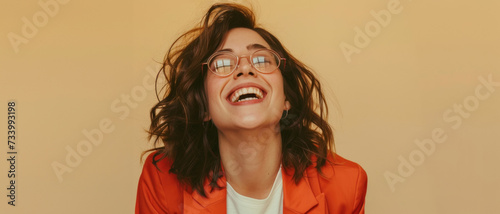 Exuberant woman laughing with joy, her vivacity and spontaneous happiness conveying a sense of freedom and light-heartedness