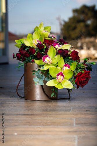 Fototapeta Naklejka Na Ścianę i Meble -  Bouquet of Flowers in Vase on Wooden Floor