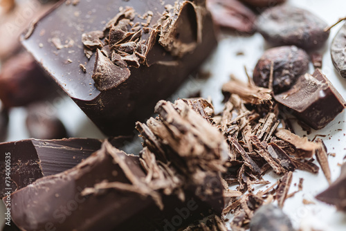 Cocoa beans with chocolate on a white background. Shalllow dof. photo