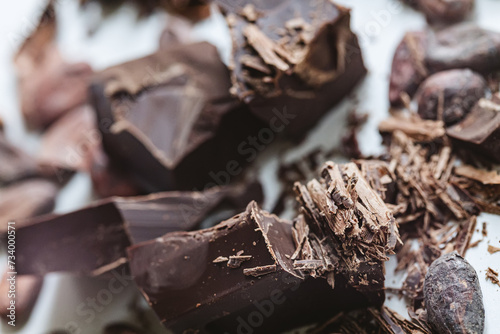 Cocoa beans with chocolate on a white background. Shalllow dof. photo