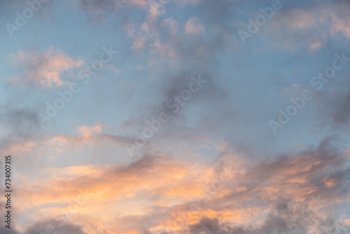 Sunset with orange golden clouds, background with copy space