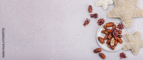 Ripe dates, traditional Ramadan Kareem concept snack for Iftar or Suhoor meal on a light background