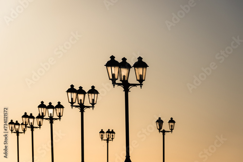 Lamps in setting sun.