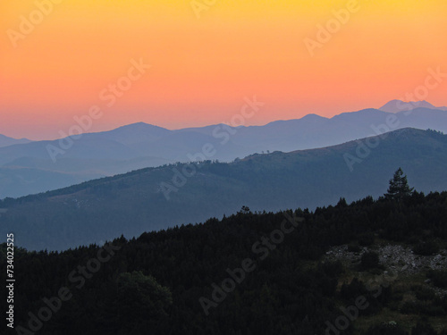 Three shades of sunset on the mountain.