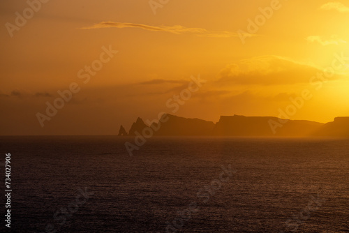 Characteristic Ilh  u da Pocari  a  cliffs at the sunrise from distance - Madeira  Portugal