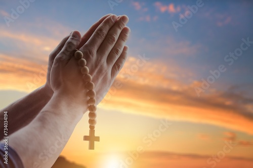 Human male hand with the rosary and cross © BillionPhotos.com