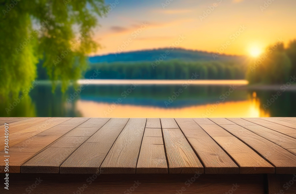 Empty wooden table with copy space for product presentation, against the backdrop of a summer lake and the setting sun. - obrazy, fototapety, plakaty 