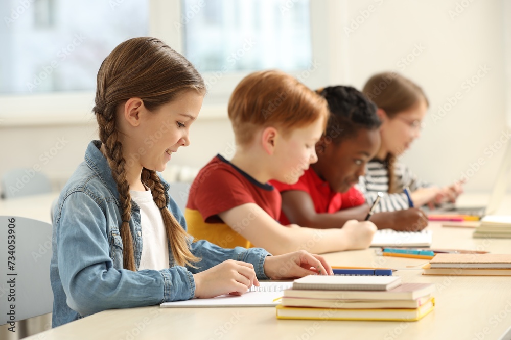 Cute children studying in classroom at school Cute children studying in classroom at school