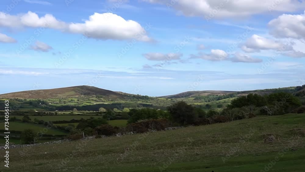 Haytor Rocks, Dartmoor's most famous landmark, is a granite tor on the eastern edge of Dartmoor in Devon, UK. sunny day. Haytor Rocks, Dartmoor's most famous landmark, is a granite tor on the eastern edge of Dartmoor in Devon, UK. sunny day.