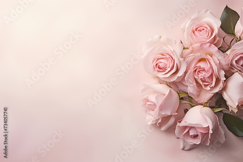 High-resolution capture of a bouquet of roses on a pastel surface, providing an elegant setting for text incorporation. © Kanwal