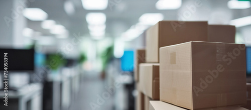 Blurred defocused office space with office furniture Packing cardboard mockup boxes and cartons at the foreground. Moving in or out and relocation services. Closing down or opening business. Delivery