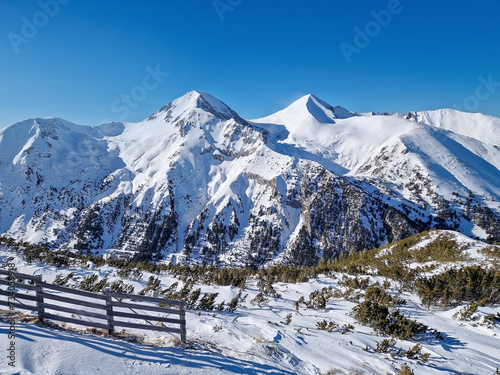 Pirin mountains peaks covered with snow. Winter scenery at Bansko ski resort in Bulgaria photo