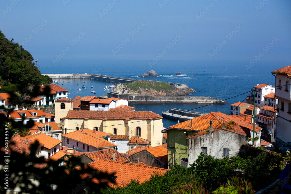 View of Cudillero, typical Asturias fishing village with the port in the background