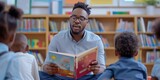Engaging Male Teacher Captivates Kindergarteners While Reading A Delightful Picture Book. Concept Engaging Male Teacher, Captivating Kindergarteners, Delightful Picture Book, Reading Aloud
