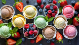Ice cream assortment. Selection of colorful ice cream with berries and fruits on dark rustic table. Top view