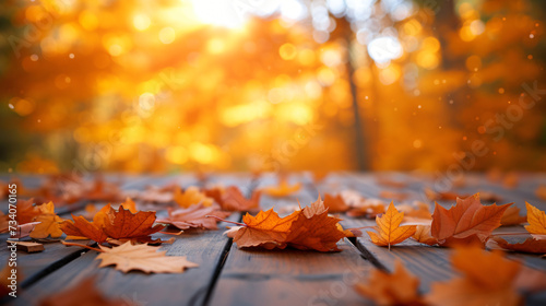 Orange fall leaves on wooden floor, autumn natural...