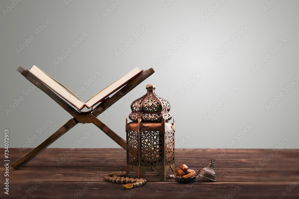 The Holy Quran book with calligraphy and beads