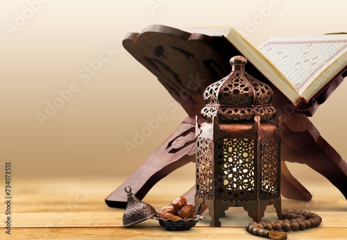 The Holy Quran book with calligraphy and beads © BillionPhotos.com