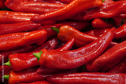 fresh organic red pepper from farm close up from different angle, green paprika in the grocery store photo