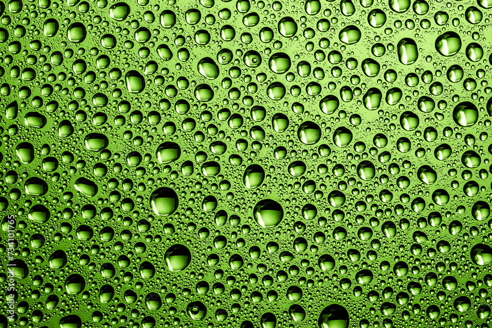 Water drops background. Wet glass surface texture. Winter window condensation. Bubble dew pattern. Transparent window green raindrops. Humidity condensation texture. Eco green color water.