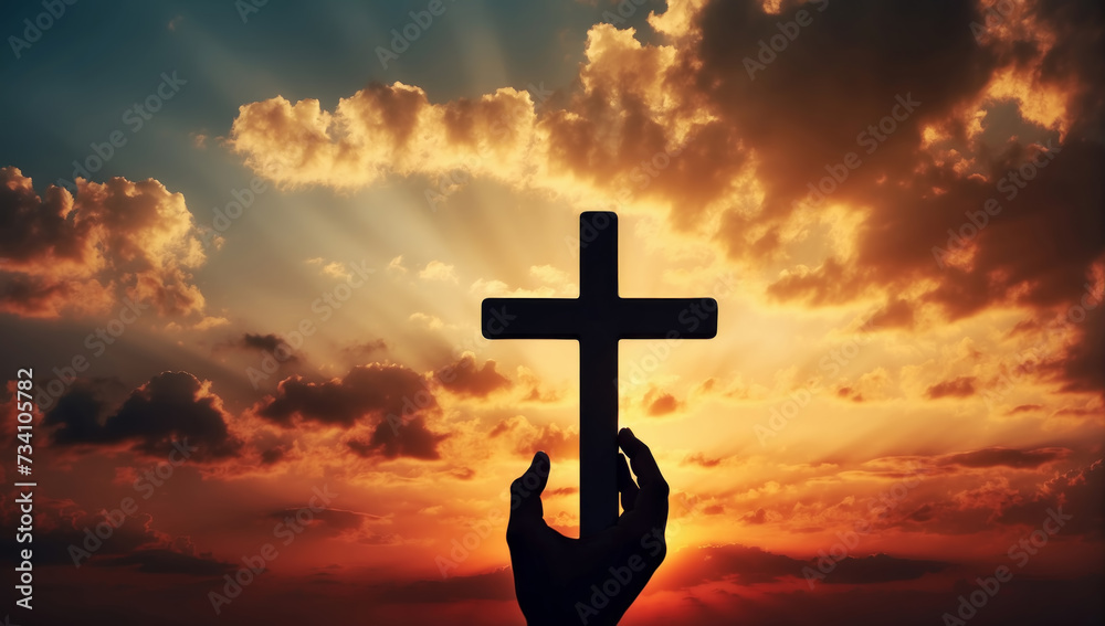 Black silhouette of the cross in the human hand on sunset sky background. AI generated