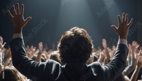 Man raising hands in worship in front of people in the church. AI generated photo