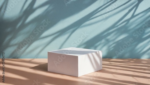 Podium for product  white square with light blue background and leaf shadow